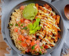 a bowl filled with rice, meat and veggies