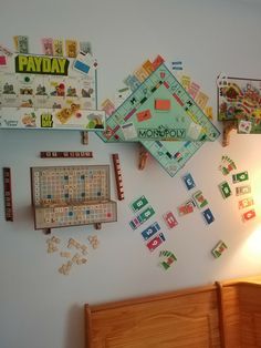 a board game on the wall next to a bed