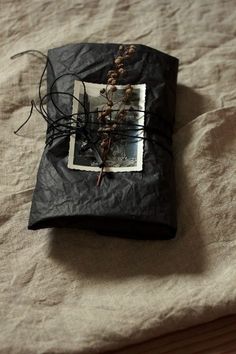 a black bag sitting on top of a bed