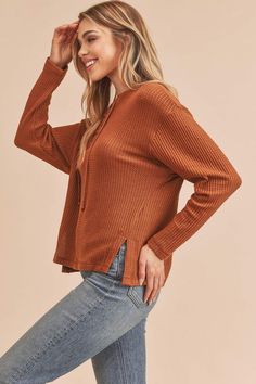 The Carole Sweater features a slouchy, oversized fit with a ribbed knit top for and lace-up detailing at the henley neckline. Style: Casual Print / Pattern: Rib Knit Fit: Oversized Neck Line: Henley Sleeve: Long Sleeve Closure: Lace-up Made In: Imported Fabric Contents: 96% Polyester 4% Spandex Non-sheer fabric Size Measurement (inch): S: 20.0 (Bust), 21.0 (Waist), 21.0 (Hips), 22.0 (Length) M: 20.5 (Bust), 21.5 (Waist), 21.5 (Hips), 22.5 (Length) L: 21.0 (Bust), 22.0 (Waist), 22.0 (Hips), 23.0 Casual Winter Waffle-knit Henley, Casual Winter Waffle Knit Henley, Fall Waffle Knit Henley With Henley Neckline, Casual Waffle Knit Henley For Fall, Fall Waffle Knit Henley, Everyday Fall Waffle Knit Henley, Fall Everyday Waffle Knit Henley, Fall Waffle Knit Henley For Everyday Wear, Casual Ribbed Henley For Winter