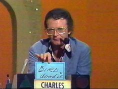 a man sitting at a table in front of a sign that says bird doodles