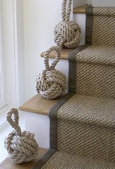 rope wrapped balls on the bottom of stairs