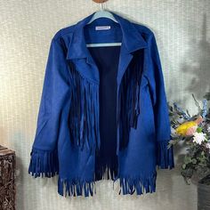 Gorgeous Women’s Blue Faux Suede Jacket By Misslook. Accented With Fringe On Sleeve Bottoms, Front Center Down And Front And Back Bottom. New Without Tags. Size Xxl. Measures: 18 Inch Shoulder To Shoulder 29 Inch Shoulder To Bottom 21 Inch Pit To Pit 24 Inch Sleeve Winter Long Sleeve Outerwear With Tassels, Winter Outerwear With Tassels And Long Sleeves, Fringe Long Sleeve Outerwear For Winter, Fall Outerwear With Tassels, Spring Blue Outerwear With Tassels, Blue Spring Outerwear With Tassels, Blue Outerwear With Tassels For Spring, Blue Tasseled Outerwear For Fall, Blue Long Sleeve Outerwear With Tassels