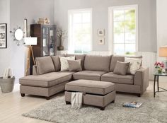 a living room with a sectional couch and ottoman