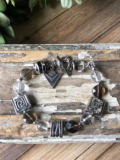 "~ Smoky Quartz & Crystal Bracelet with Sterling Silver Artisan Bead Accents ~ Silpada Arrowhead Logo Charm on Toggle Clasp ~ Adjustable ~ Fits up to 8\" Wrist ~ .925 & Silpada Logo Stamped ~ Excellent Condition Display Item" Silpada Jewelry, Sterling Silver Bead Bracelet, Smoky Quartz Crystal, Silver Bead Bracelet, Toggle Clasp, Logo Stamp, Smoky Quartz, Sterling Silver Bead, Crystal Bracelets