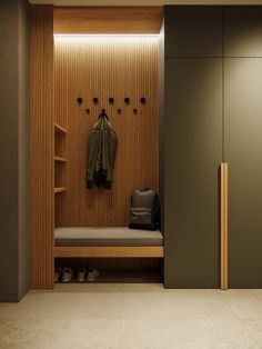 a coat rack and bench in a room