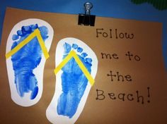 a hand and foot print on a bulletin board that says follow me to the beach