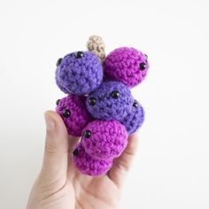 there is a small crocheted toy in the hand