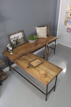 two wooden tables sitting next to each other in a room