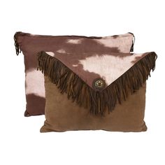 two brown and white pillows with fringes on them