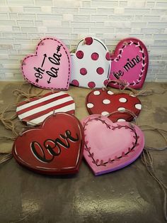 valentine's day cookies are arranged on a table