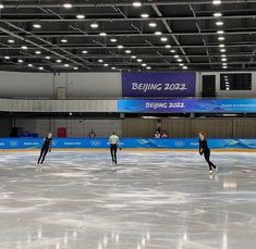 some people are skating on an ice rink