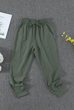 Green Causal Pockets Pants Casual High Waist Capris With Pockets, Casual High-waist Capris With Pockets, Casual Solid Color Spring Capris, Casual Khaki Cotton Capris, Casual Capris With Pockets For Loungewear, Casual Capris With Elastic Waistband For Fall, Non-stretch Cotton Capris With Pockets, Khaki Bottoms With Pockets For Loungewear, Khaki Lounge Bottoms With Pockets