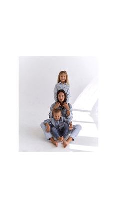 three children sitting on top of each other in front of a white background with text that reads