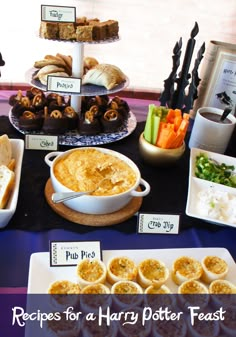 a table topped with lots of food and desserts