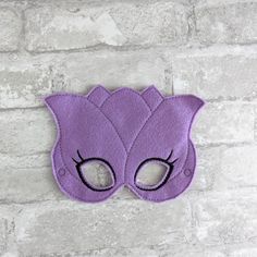 Everyone loves a good dress-up masks! Our quality felt masks encourage imaginative play and help to create hours of joyful dress up time. Have you been looking for something fun and special for a party favor? Search no further! All of our masks are made from two layers of high quality felt and include an adjustable elastic band. Masks are made as shown in photos by me and my commercial embroidery machines. Each mask is made with care and special attention to detail. Most designs are available in Playful Eye Mask For Masquerade, Fun Eye Mask For Masquerade, Novelty Eye Mask For Carnival, Carnival Novelty Eye Mask, Joyful Dress, Band Masks, Felt Masks, Commercial Embroidery Machine, Cute Masks