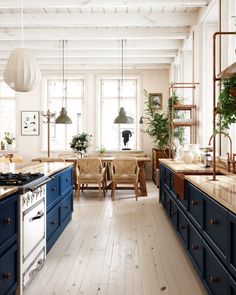 the kitchen is clean and ready for us to use it's blue cabinetry