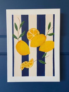 a painting of lemons on a blue and white striped background