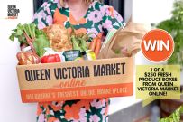 a woman is holding a box full of fresh produce and vegetables with the words queen victoria market online on it