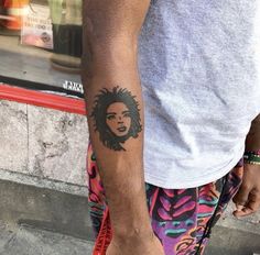 a man with a tattoo on his arm