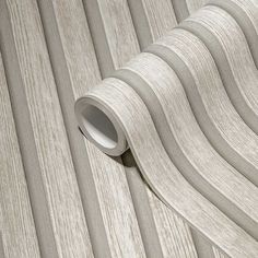 a close up view of a wallpaper with wood grains and stripes on it