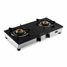 two burners on top of a stove with black and silver trims, one is gold