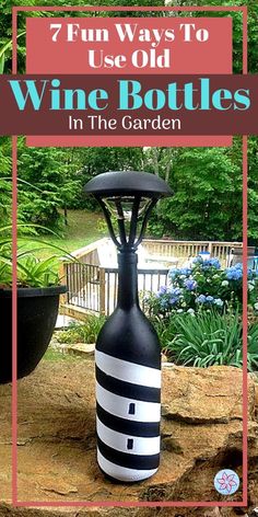 a wine bottle sitting on top of a wooden table next to a potted plant