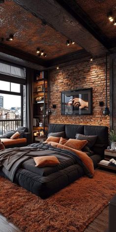 a large bed sitting in the middle of a living room next to a brick wall