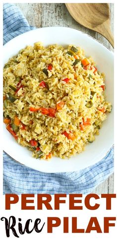 a white plate topped with rice and vegetables