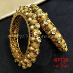 Jaipuri Rajwadi Golden Kada Bangles with Kundan stones Features: Made in Brass with 22 Karat Gold polish Pair of 2 Bangles Thickness: Approx. 0.5 Inches Openable Bangles with screw closure Rajasthani Jaipuri Bangles Available in size 2.6,2.8 Jaipuri Bangles, Kada Bangles, Antique Jewellery Designs, Stone Feature, Bangle Designs, Gold Polish, Antique Jewellery, Wrap Bracelet, Colored Diamonds