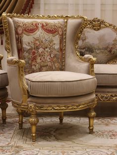 an ornately decorated couch and chair in a living room