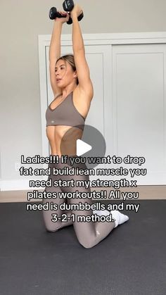 a woman is doing squats with dumbbells on her chest and arms behind her head