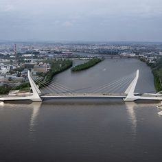 an aerial view of a bridge spanning the width of a river