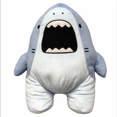 a stuffed shark with its mouth open