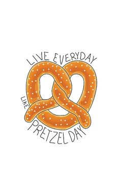 a pretzel with the words live everyday on it's front and back