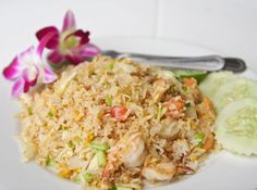 a white plate topped with rice and vegetables