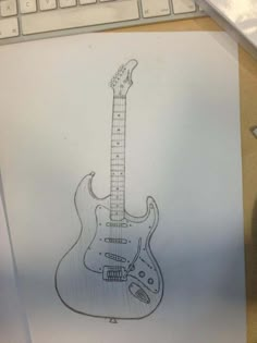 a drawing of an electric guitar sitting on top of a desk next to a keyboard