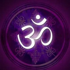 the om shan symbol is illuminated in purple light