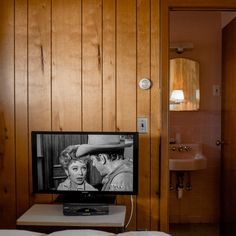 a television sitting on top of a wooden table