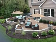 an outdoor patio with seating and umbrellas