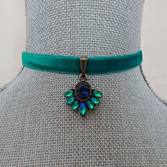 A turquoise velvet ribbon choker style necklace is accented with a rhinestone pendant. The rhinestones are a vibrant two-tone turquoise shade complimenting the rich tone velvet ribbon. The focal is linked to an antique brass slider pinch bail.  The choker measures 13" on first link closure and with the extension it can be adjusted 15" closure. The width of the ribbon is 3 /8 ".  The extension chain is antique brass curb chain with a wire wrapped antique brass ornate bead dangle and there is a matching hook closure for adjustable length. All of my jewelry items come boxed and lace ribbon tied and tagged for easy gifting. Velvet Choker Necklaces, Ribbon Choker, Choker Style Necklace, Velvet Choker, Gilded Age, Choker Style, Lace Ribbon, Choker Necklaces, Velvet Ribbon