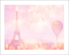 the eiffel tower and hot air balloon are seen in this artistic photo from paris