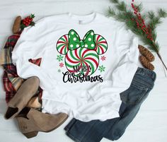 DESCRIPTION Minnie Peppermint Christmas Long Sleeve Shirt, Peppermint Candy Cane Shirt, Minnie Christmas Shirt, Mouse Kingdom Shirt, Holiday Shirt  DETAILS These great classic retail fit unisex long sleeves tees are very high-quality and extremely comfortable. You are sure to get lots of looks and great comments by everyone who sees this beautiful shirt. Casually elegant with an excellent quality print, it is an irreplaceable everyday item for anyone. CONSTRUCTION DTG printing with eco-friendly Candy Cane Shirt, Christmas Long Sleeve Shirts, Disney Christmas Shirts, Minnie Christmas, Peppermint Candy Cane, Peppermint Christmas, Casually Elegant, Peppermint Candy, Holiday Shirt