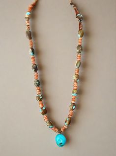 Crafted with vintage #8 turquoise beads, stunning faceted sunstone beads, and a beautiful Kingman turquoise pendant, this necklace is a true statement piece! At 16 inches long with a one inch extender, it can be adjusted for the perfect fit.