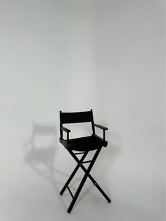 a black director's chair against a white background