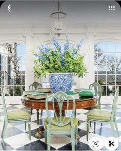 the dining room table is surrounded by green chairs