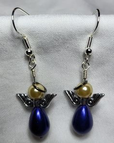 These Blue Rain Drop and "Dirty" White Pearl, Sterling Silver Halo and hooks. Hook Earrings make great gifts for any occasion! Birthday, Friend, Co-Worker, Christmas, Valentines, just because and many more! Handcrafted by me, I used blue rain drop beads and small pearl beads with sterling halo, wings and hooks that are also hypoallergenic.  These are a excellent gift idea for girls and women alike. They make a excellent gift idea for any occasion such as Anniversary, Birthday and Christmas! Plea Nickel-free Blue Pearl Earrings Gift, Gift Hypoallergenic Drop Earrings, Blue French Hook Jewelry As Gift, Blue Earrings For Christmas Gift, Hypoallergenic Dangle Earrings For Gift, Pearl Halo, Friend Anniversary, Dirty White, Birthday Friend