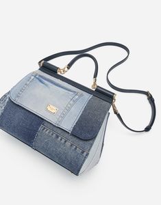 Large Sicily bag in calfskin and patchwork denim: Blue Front flap with hidden double magnetic fastening Logo tag featuring two metal plating finishes Top handle and adjustable, detachable strap in calfskin Printed fabric lining Inner pocket with branded zipper and a cell phone holder Metal feet studs on the base Item comes with a branded dust bag Measurements: H22 x W25 x D12 cm Made in Italy Designer Denim Travel Bag, Luxury Denim Shoulder Bag For Travel, Luxury Denim Bag For Daily Use, Luxury Denim Blue Denim Bag, Designer Denim Shoulder Bag With Branded Hardware, Daily Use Denim Shoulder Bag With Branded Hardware, Daily Denim Shoulder Bag With Branded Hardware, Luxury Denim Blue Bag For Daily Use, Designer Denim Blue Bags