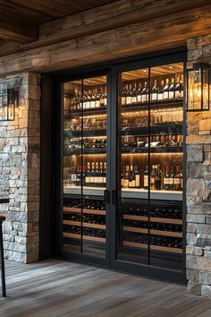 the wine cellar is stocked with many bottles and glasses on display in front of the door