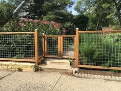 a fenced in area with steps leading up to it